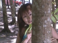 Cute and bosomy Japanese lady Yoko Matsugane walks in woods